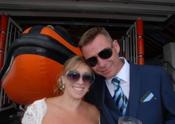Rye Harbour lifeboat crew members Sharon Gosna and Tony Peters got married on July 9. Photo courtesy of Rye Harbour RNLI SUS-160308-134557001