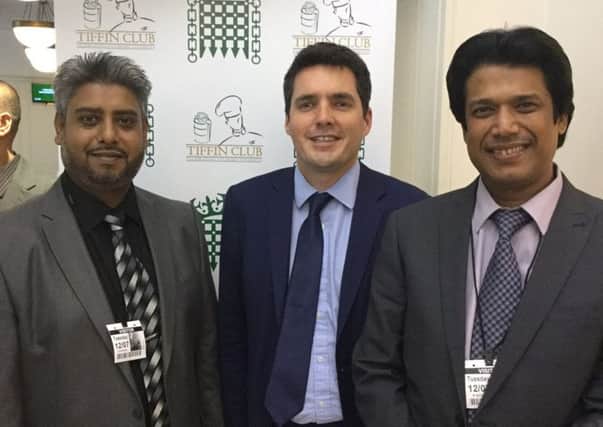 Bexhill and Battle MP Huw Merriman with The Shiplu owner Abul Azad and his business partner, Ahmed Ali, at the Grand Final in the House of Commons on July 2. Photo by Mr Merriman SUS-160308-172904001