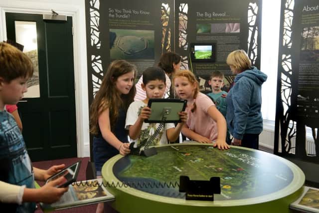 Local schoolchildren at the opening of the 'Secrets of the High Woods' exhibition in the library of the South Downs Centre, Midhurst, June 8