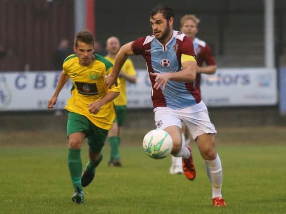 Hastings United defender Richard Davies on the run against Westfield. Picture courtesy Scott White