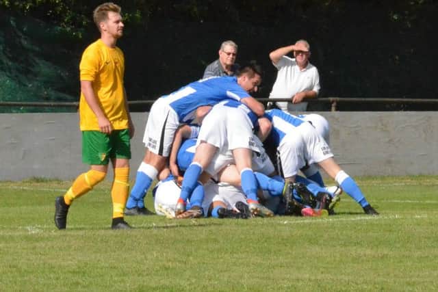 Heath players celebrating the first goal. Holmesdale v Haywards Heath Town in the FA Cup. Picture by Grahame Lehkyj