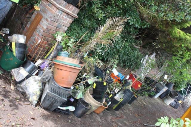 Rother District Council officers cleared piles of rubbish and debris from the front garden of Anthony Hamiltons home in Southcourt Avenue, Bexhill. SUS-160908-130327001