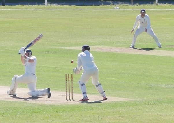 Hastings Priory v Horsham cricket action - Elliot Hooper bowls Horsham captain Michael Thornely SUS-160908-090507002