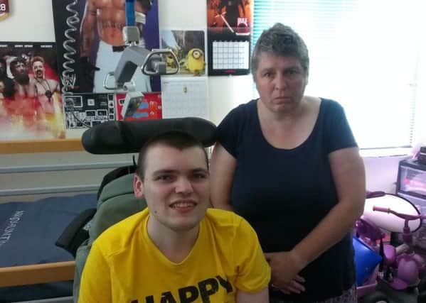Simon Perkins, 21, with his mother Amanda. Pictured above Simon is the hoist which broke on Tuesday, August 9