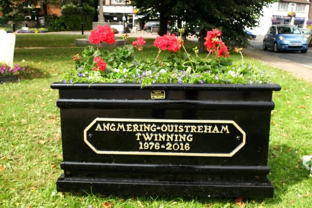 A commemorative planter in the Village Green marks the occasion