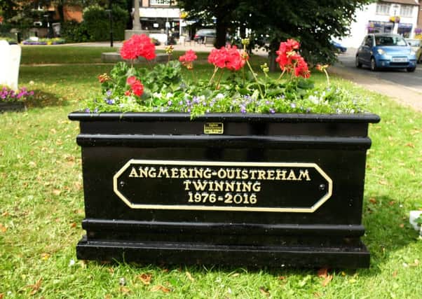 A commemorative planter in the Village Green marks the occasion