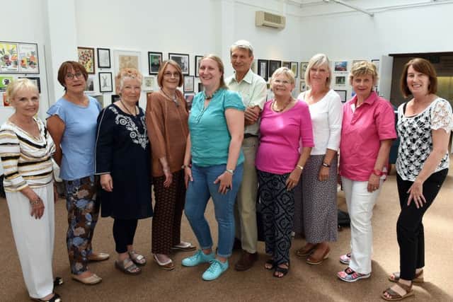 Some of the 38 artists who exhibited their work at the gallery, with course teacher Tricia Johnson (centre)