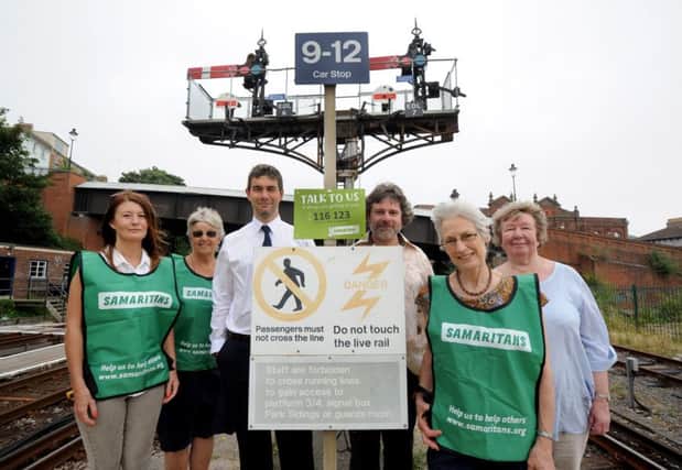 Samaritans signs at Hastings Station.

Mark Lawson, driver manager at Hastings station, pictured with representatives from the Samaritans. SUS-160720-140143001
