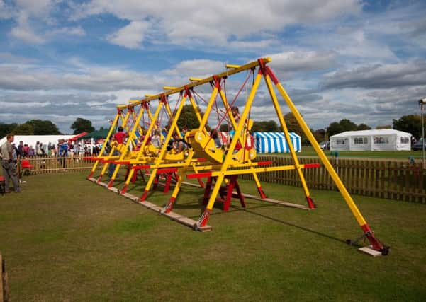 The  popular swing boats have been given a face-lift ahead of the Wisborough Green annual fete