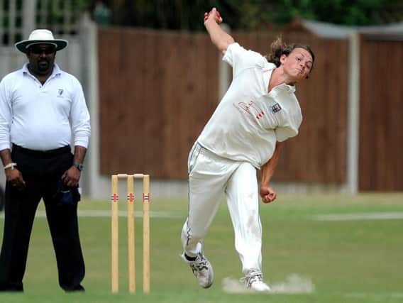 Joe Cox bowling for Bexhill in the reverse fixture against Roffey during June. Picture by Steve Robards