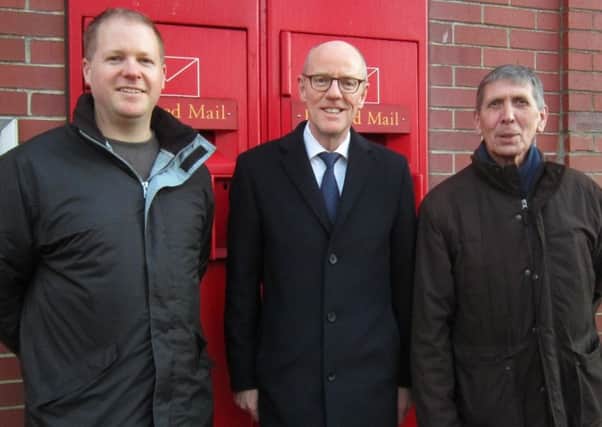 From left: Paul Wells, Nick Gibb and Pat Dillon outside Bognor Regis Post Office SUS-160125-094048001