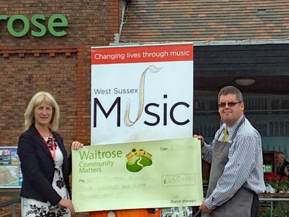 Worthing Music Centre receives a 450 cheque from Waitrose Worthing