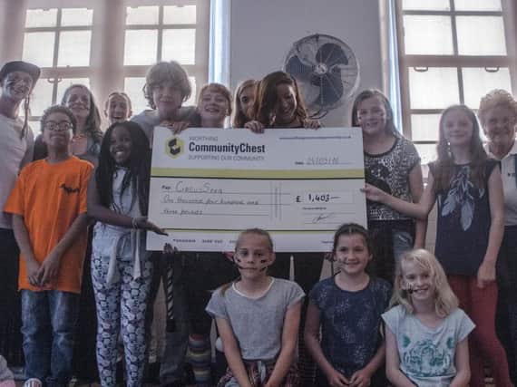 Worthing Community Chest presents social enterprise CircusSeen with a cheque for 1,403