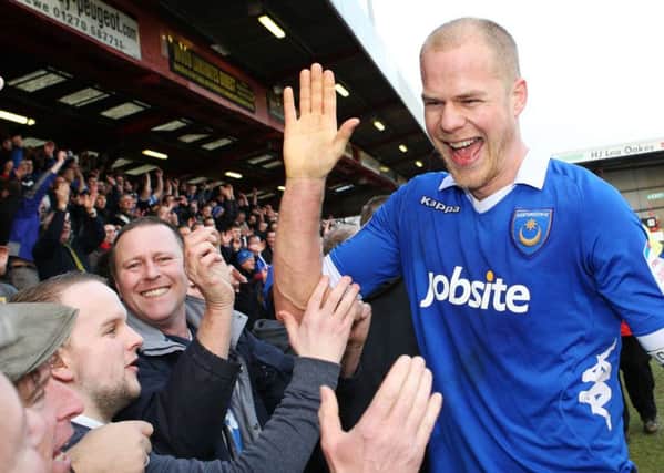Johnny Ertl celebrates with the Pompey fans after victory at Gresty Road in March 2013 Picture: Joe Pepler
