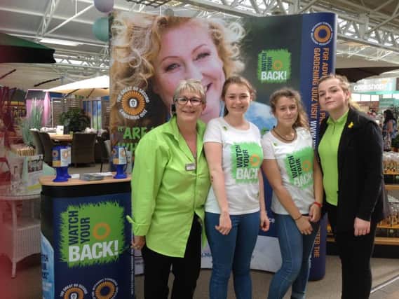 Melanie Howick, customer service team leader, and Paige Simms, customer service assistant, with the Watch Your Back  team at the Roundstone garden centre