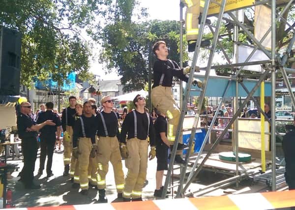 Firefighters took on a gruelling charity challenge in Horsham today