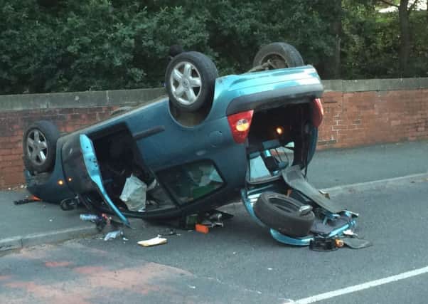 Car on its roof in East Grinstead
