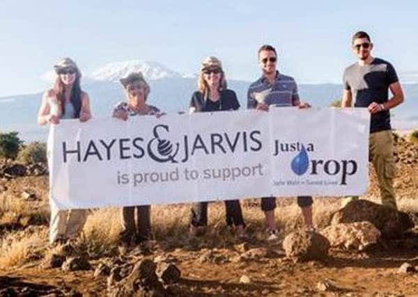 From left, Hayes and Jarvis colleagues Stephanie Rock, Barbara Clark, Katie Parsons, Nick Wilson and Taylor Oliver on their last trip to Kenya standing against the backdrop of Mt Kilimanjaro.