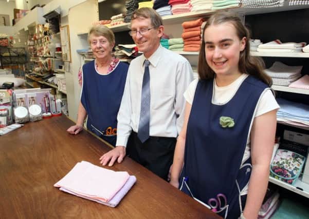 Anne Worrall, Colin Buxton and Jo Armstrong behind the counter at Baldwins. Photo: Derek Martin