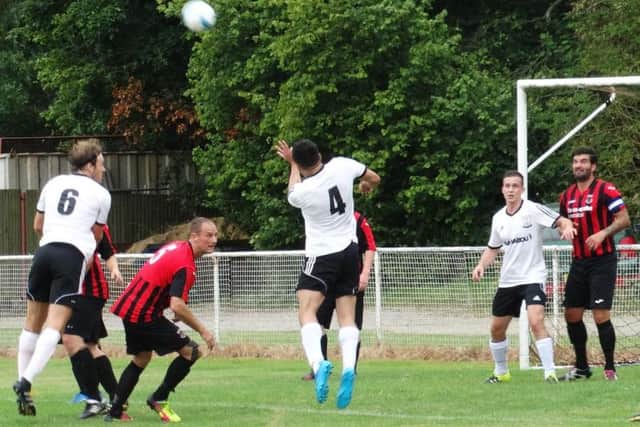 The heads go up at a corner during Bexhill's opening day game at Oakwood. Picture courtesy Mark Killy
