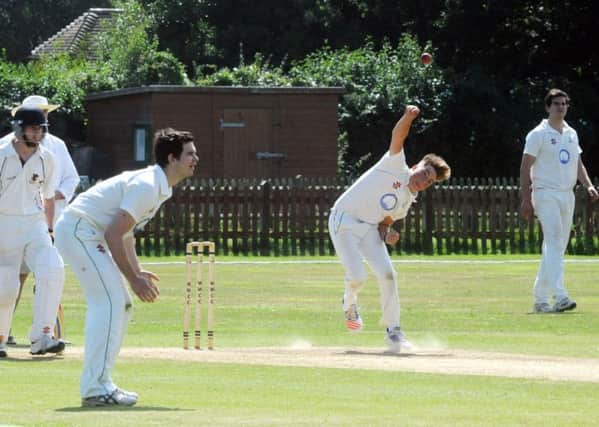 Kieran Baker bowls to help West Wittering to victory over Horsham III - and to promotion / Picture by Kate Shemilt