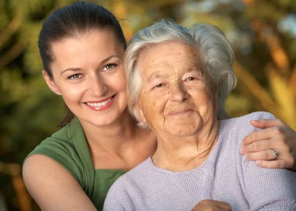 Woman in her late twenties embracing a senior lady. Stock image for National Carers Week SUS-160519-084448001