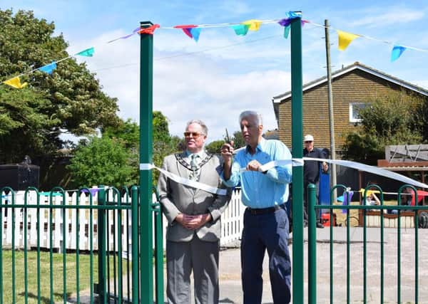 Arun District Council chairman Stephen Haymes with newsreader Nicholas Owen, right, cutting the ribbon