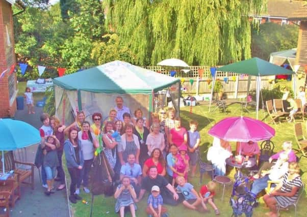 Residents and families enjoying the summer fÃªte at Warmere Court care home in Yapton
