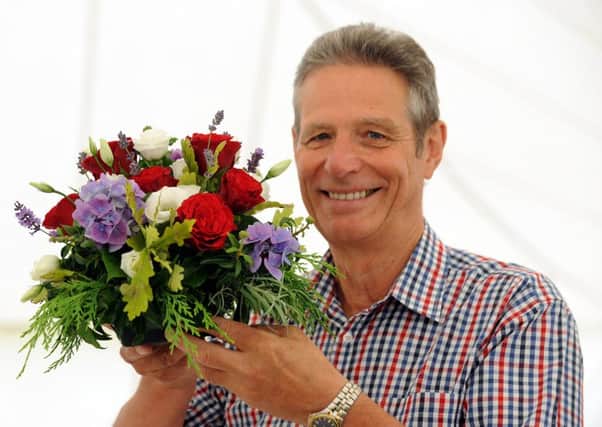 Tim Bonner with his entry in the floral art section. Picture: Kate Shemilt ks16000895-3