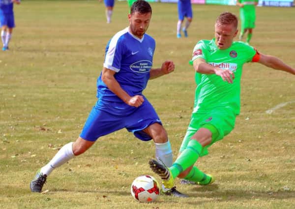 Shoreham's Scott Packer in action against Dorking Wanderers on Saturday. Picture by Terry Buckman