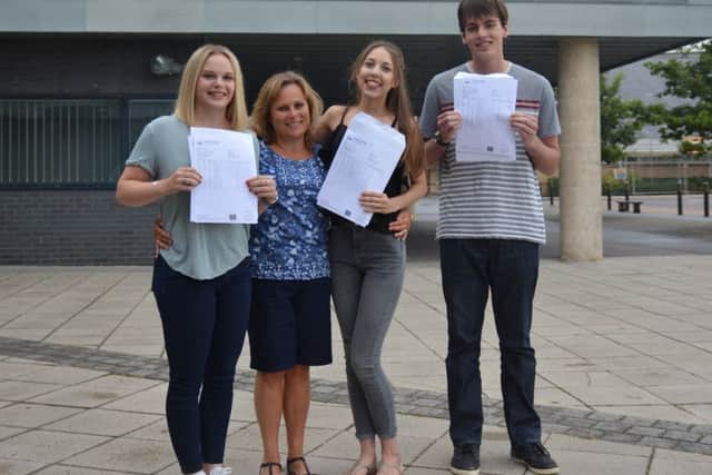 From L to R: Katy Greene, 18, Mrs Hook, head of Sixth Form, Lucy Stubbings, 18, and Reece Mears, 18