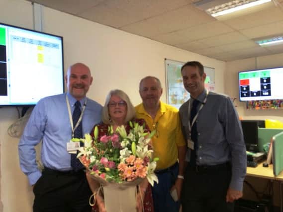 Olive with, from left, head of business and technical services Steve Spinner, husband Hugh Mulloy and customer services manager Dominic O'Brien
