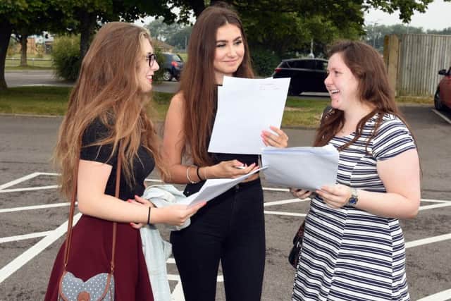 Students celebrate their exam results at Littlehampton Academy. Picture : Liz Pearce