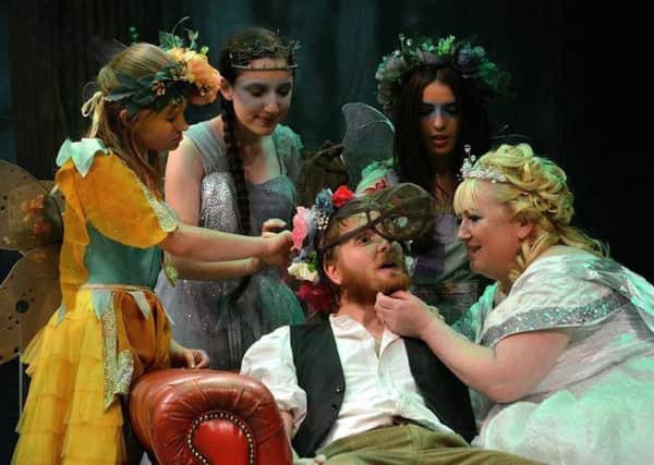 Bottom (Tom Hounsham) with Titania (Tess Kennedy) and the fairies. Picture by Sam Taylor