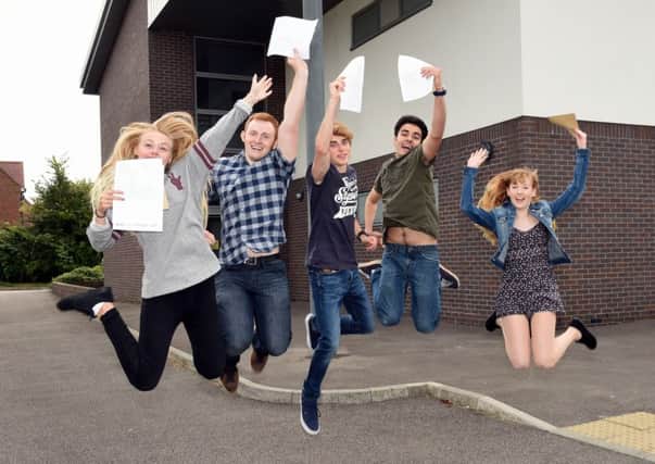 Students celebrate their exam results at Angmering School.  Pictured are L-R Georgia Towson (18), Arran Collis (18), Adam Woodard (18), Jake Gander (19) and Bethan Williams (18). Picture : Liz Pearce