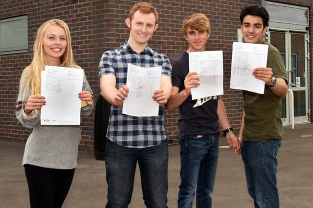 Students celebrate their exam results at Angmering School. Pictured are L-R Georgia Towson (18), Arran Collis (18), Adam Woodard (18), Jake Gander (19). Picture : Liz Pearce
