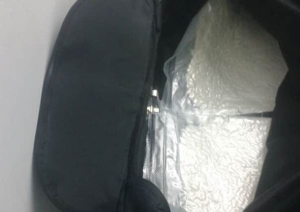 Suitcase filled with bags of cocaine at Gatwick. Photo by the Home Office
