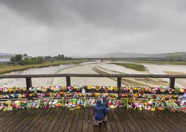 Floral tributes left on the Old Toll Bridge in Shoreham, after the Shoreham air crash. Picture: Eddie Mitchell