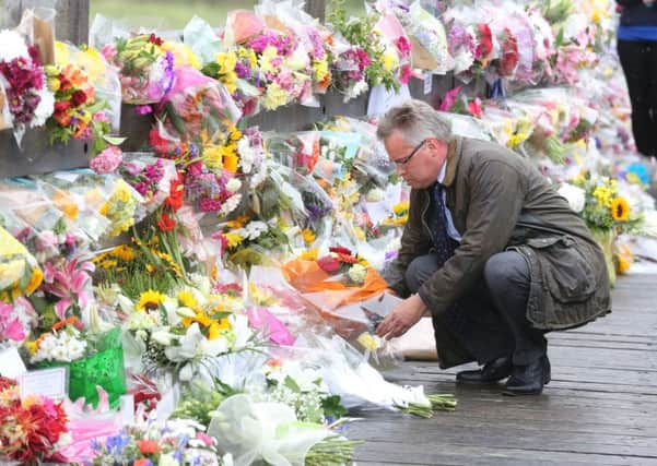 Flowers laid in memory of the airshow tragedy's victims. Picture by Eddie Mitchell.