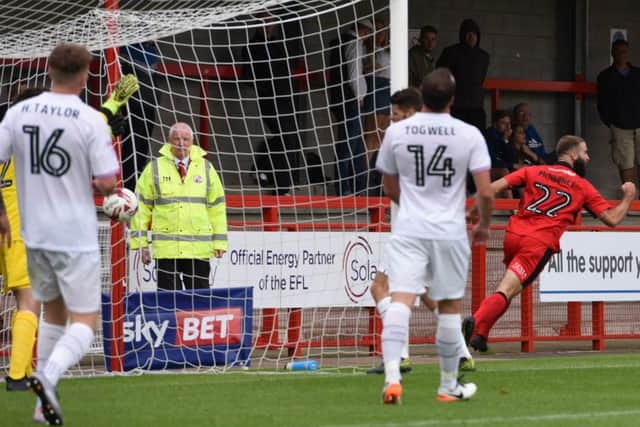 Joe McNerney reels away after scoring Crawley Town's equaliser during their 1-1 draw with Barnet. Picture by Phil Westlake SUS-160820-235426002