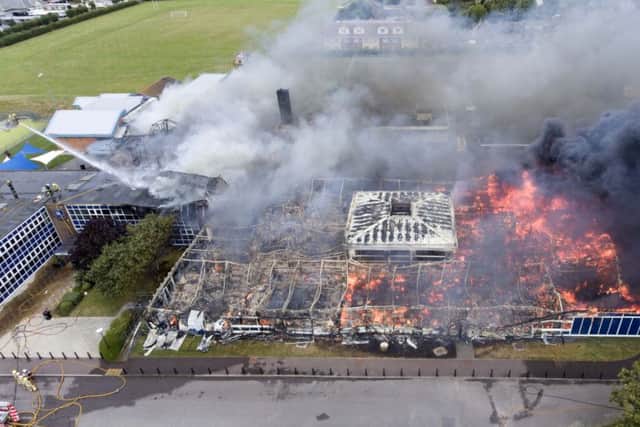 The fire service said more than 75 per cent of the school building was engulfed by flames. Picture by Eddie Mitchell SUS-160821-113609001