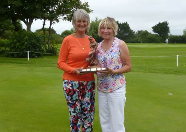 Sue Bywater presents the Grandmother's Trophy to Barbara Winter