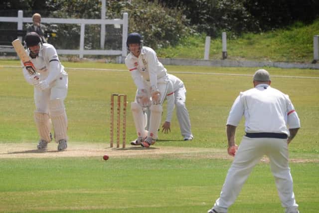 Mick Glazier prepares to field the ball at midwicket during Priory's defeat to East Grinstead. Picture by Justin Lycett