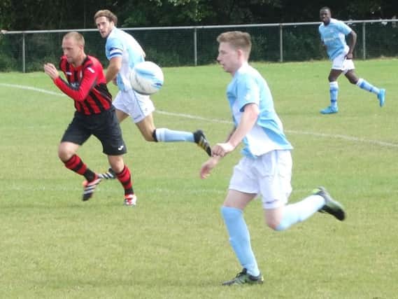 Bexhill United match-winner Corey Wheeler on the charge against Saltdean United. Picture courtesy Mark Killy