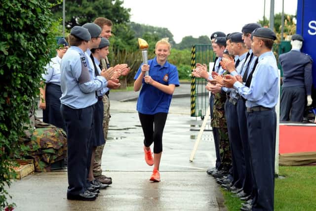 ks16000894-2 Chi Tangmere Cadet Torch phot kate  Poppy Watmore arriving with the torch at Tangmere.ks16000894-2 SUS-160820-194341008