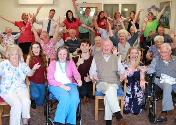 Cast members from Half A Sixpence with residents, relatives, friends and staff at Wellington Grange