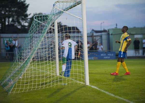 Thomas Byrne runs away to celebrate his goal against Staines / Picture by Tommy McMillan
