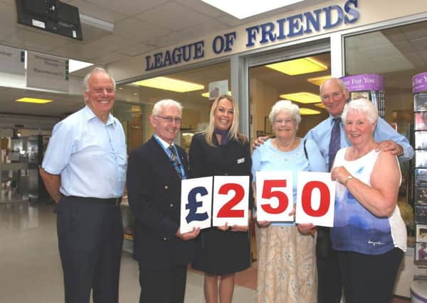 Trustees and volunteers at the League of Friends at Southlands Hospital David John Perryman, Malcolm Brett, Ann Grover and June Bradford, pictured with Taylor Wimpey Sales Executive Trudy Lampert (second from left) and Taylor Wimpey Site Manager Joe McGinley (second from right)