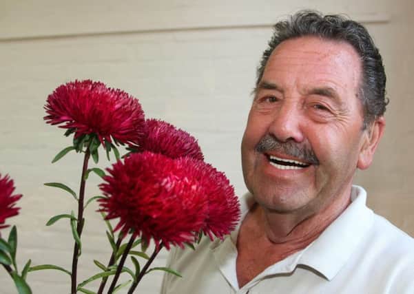 Jeff Dunstone with his first prize winning asters. Pictures: Derek Martin DM16138086a