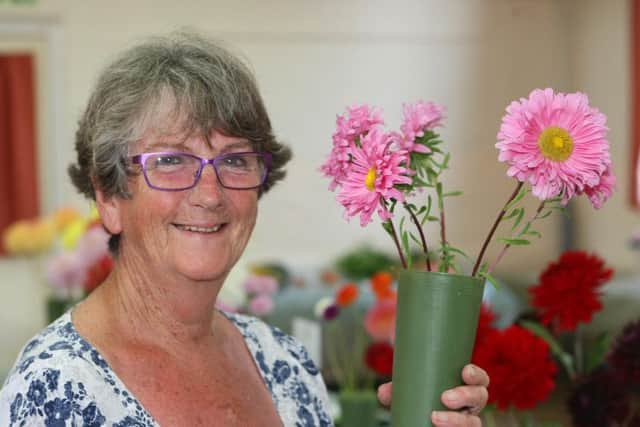 Denise Rose with her first prize winning asters DM16138082a